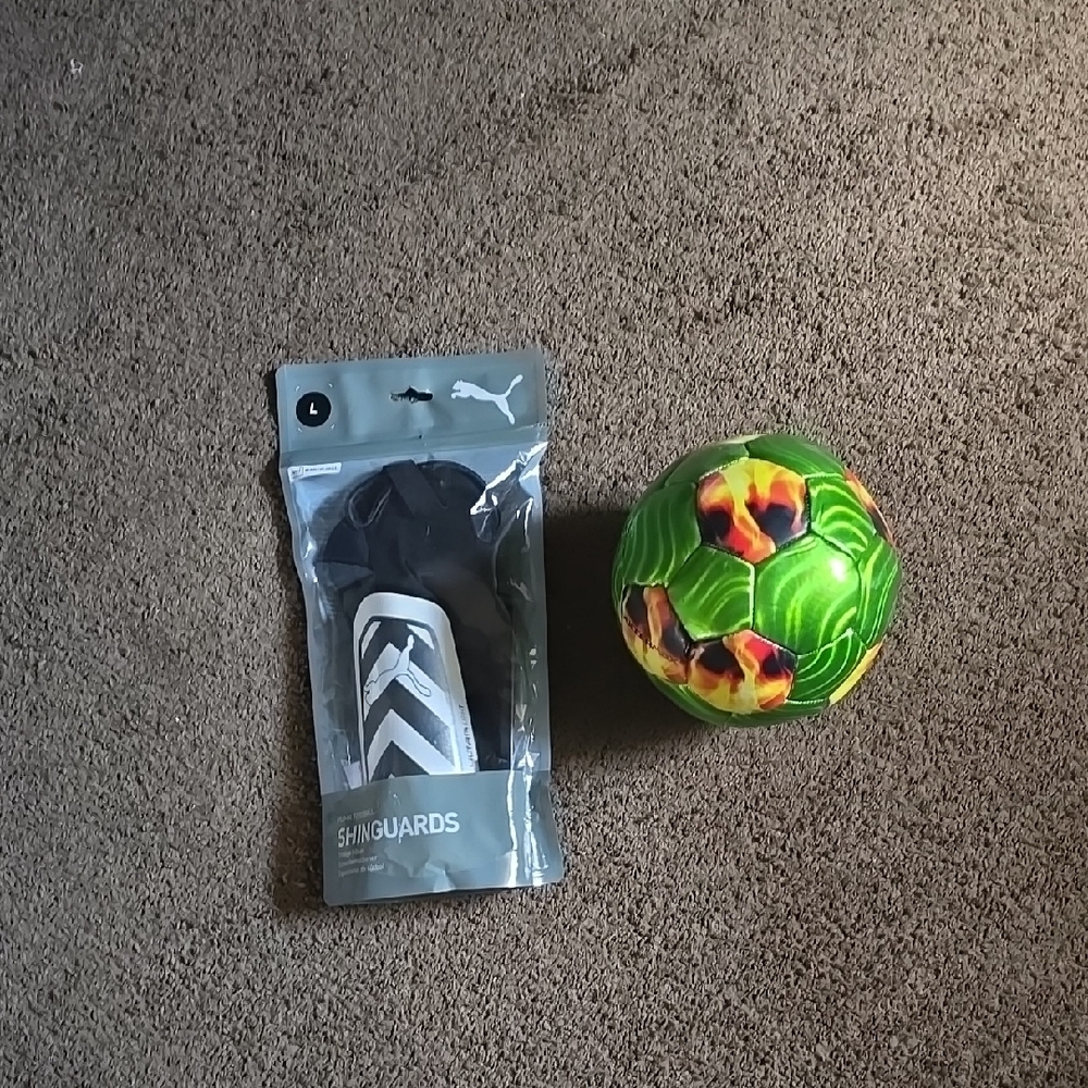 Puma Shin Guards and Colorful Soccer Ball
